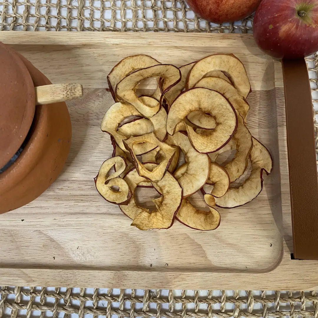 Apple chips on a cutting board